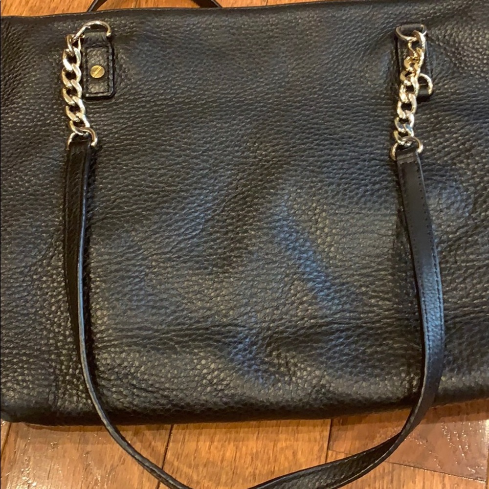 Michael Kor’s black leather bag
